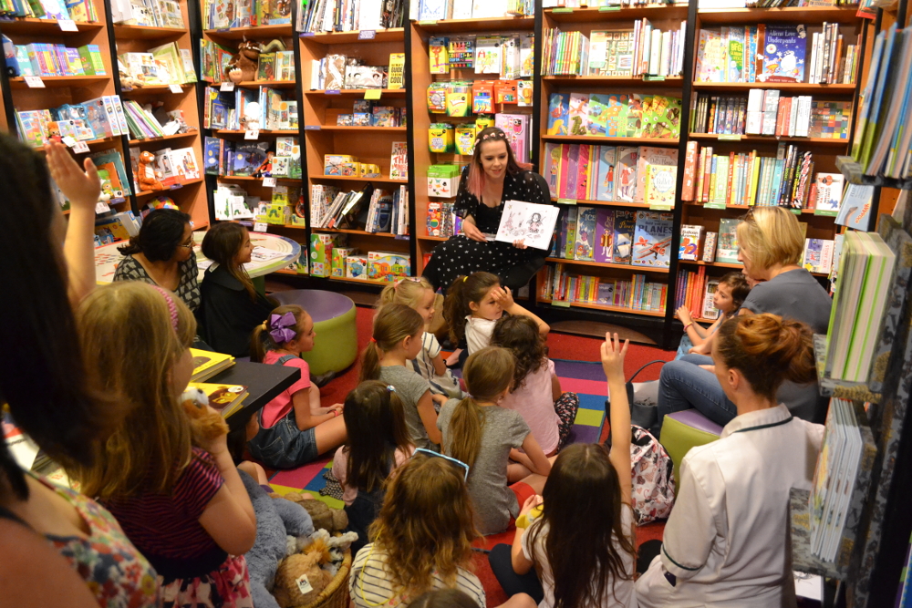 Photo of me reading from Isadora Moon Gets in Trouble at a Waterstones Hitchin promotional event, June 2017