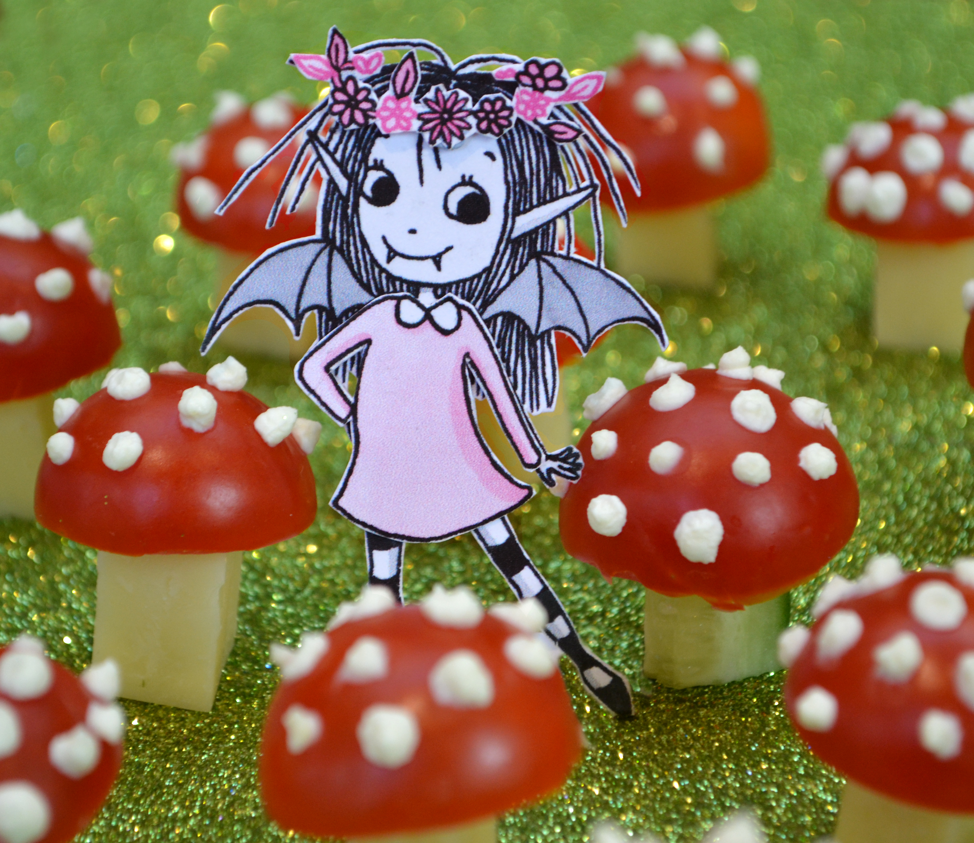 Isadora Moon posing with tomato and cheese toadstools