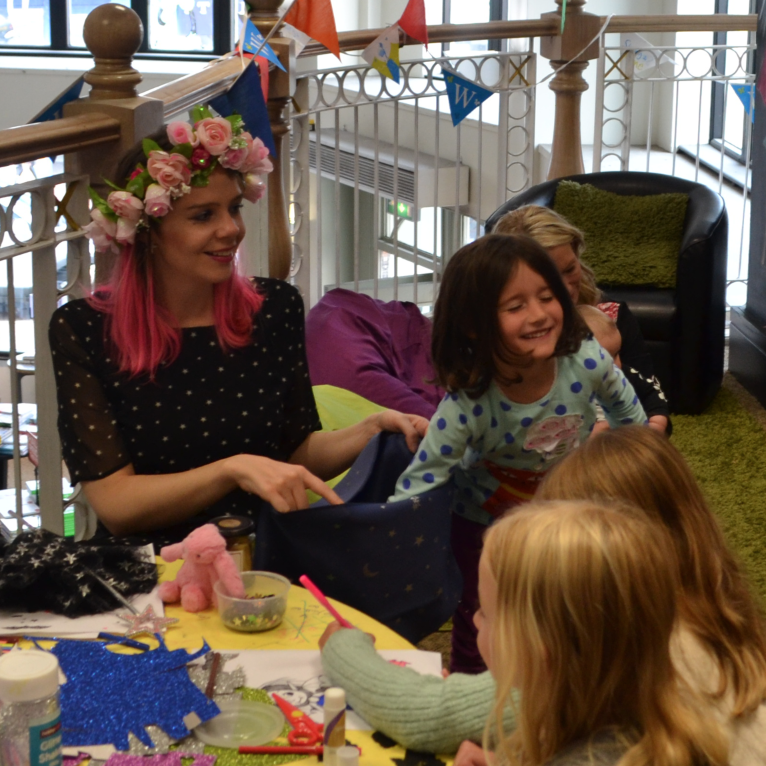 Harriet Muncaster playing Isadora Moon bag game at Derby Waterstones