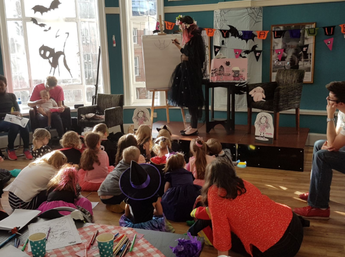 Harriet Muncaster drawing at the Manchester Waterstones Isadora Moon Halloween Party