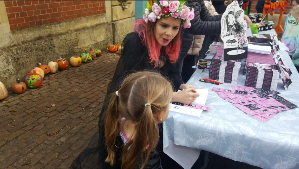 Harriet Muncaster signing copies of Isadora Moon at Waddesdon Manor