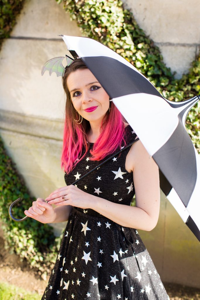 Harriet Muncaster with stripy umbrella