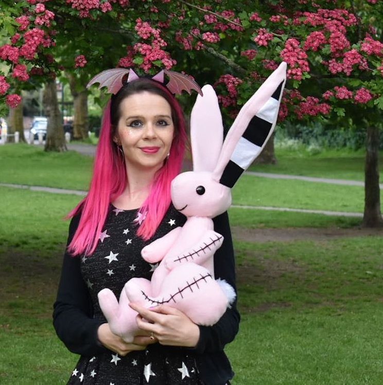 Harriet Muncaster holding Pink Rabbit from Isadora Moon