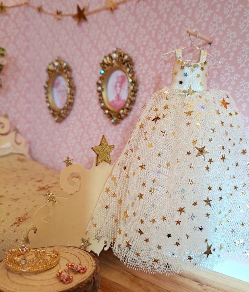 Golden starry wiskling dress for hung in Celestine's miniature bedroom by Harriet Muncaster